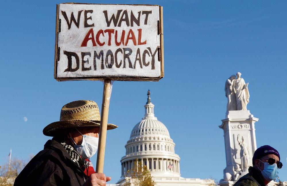 Where does India rank in the latest democracy report from the V- Dem Institute?